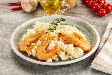 Italian risotto with prawn served thyme