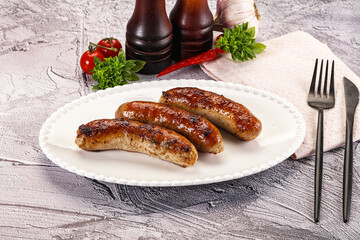 Delicous natural roasted sausages in the plate
