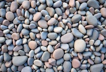 Smooth pebbles in shades of gray and pink