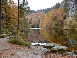 Autumn tranquility by a serene lake surrounded by colorful foliage in a tranquil forest