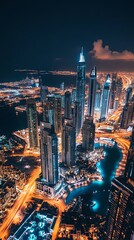 Fototapeta premium A breathtaking aerial view of a vibrant city skyline at night, showcasing illuminated skyscrapers and winding waterways, creating a captivating urban landscape.