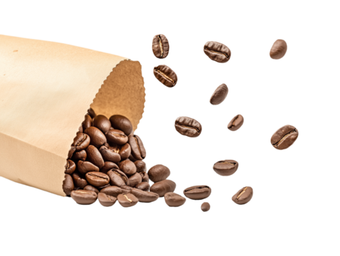 A bag of coffee beans is opened and the beans are scattered all over the table. Concept of abundance and the idea of enjoying a warm cup of coffee