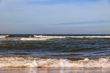 The beach in the Dutch city of Bergen on a sunny day with a blue sky
