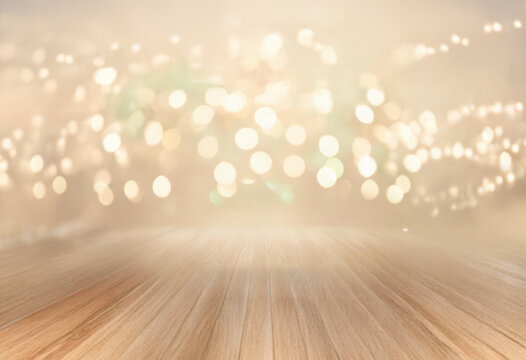 A wooden surface fades into a soft, blurred background with shimmering lights.