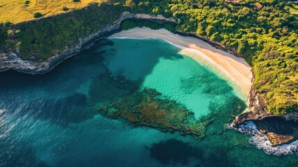 Obraz premium Aerial perspective of a stunning turquoise green beach, creating a summer background perfect for travel concepts. This turquoise green beach captures the essence of summer.