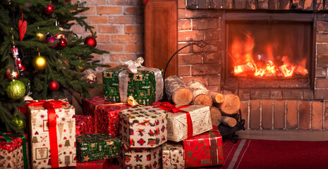 Christmas gifts under the tree near fireplace. New Year home interior