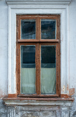 Old vintage wooden window on old house