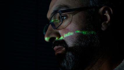 Focused Coder Analyzes Code on Computer Screen in Dark Environment - Cyber security, Cyber Attack, Penetration testing concept.