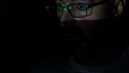 Focused Coder Analyzes Code on Computer Screen in Dark Environment - Cyber security, Cyber Attack, Penetration testing concept.