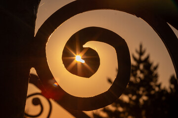 The sun's rays through the forged twisted lattice