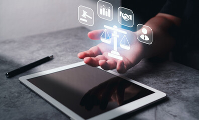 Justice and law concept. Lawyer businesswoman holding holographic interface of law innovation...