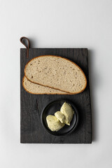 Rye Bread and Herb Butter on Rustic Black Board