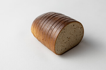 Sliced Rye Bread Loaf with Dark Crust on White