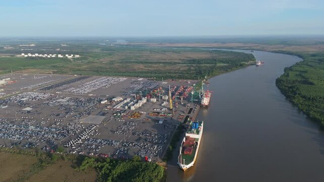 Aerial view of cargo ships unloading at Terminal Z&aacute;rate port on Paran&aacute; River, Argentina