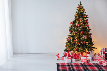 Decorating Christmas Tree with Gifts and Toys Interior New Year