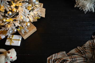 Christmas Tree with Gifts and Garland Lights as New Year Background