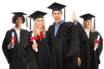 Group of happy male and female graduate students in gowns