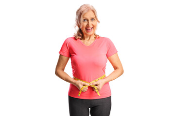 Mature woman with measuring tape around waist, weight loss concept