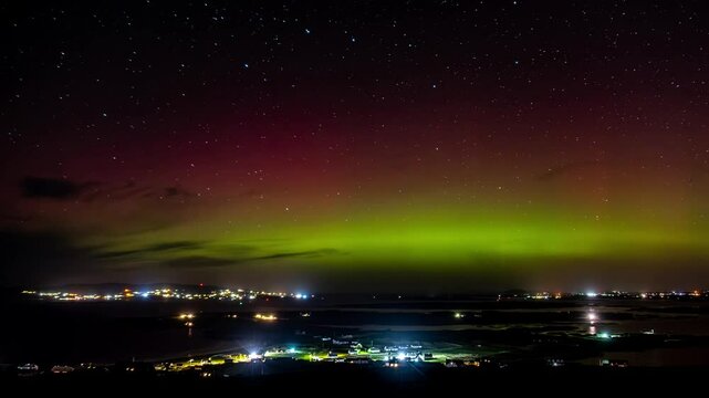 The Aurora Borealis, the northern lights, showing up above Maghery, Dungloe and Arranmore in County Donegal, Ireland.