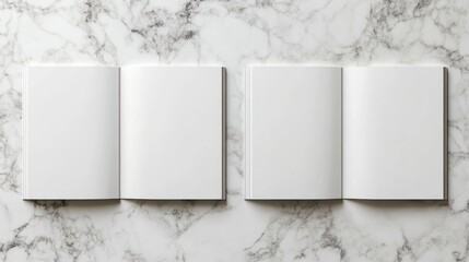 Three open blank books on a marble surface.
