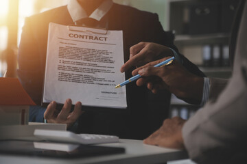 Hipster business man and Office building owner and energy engineer plan a project to build a solar panel for the building under construction. clean and green alternative energy concept.