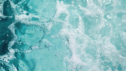Obraz premium Closeup of serene clear water surface with splashes in a stylish mint hue Swimming pool water texture creates a fresh and modern abstract natural backdrop Color trend inspiration