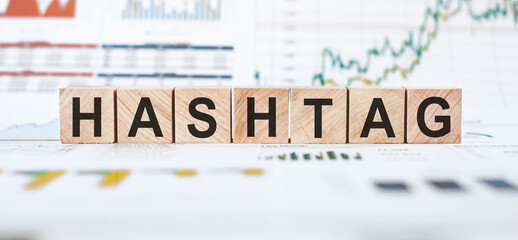 Wooden Blocks Spelling Hashtag on Financial Charts