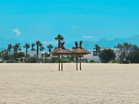 view of beach umbrellas in Cabo Negro Beach, Martil. a beach resort in northern Morocco, to the north of Tetouan