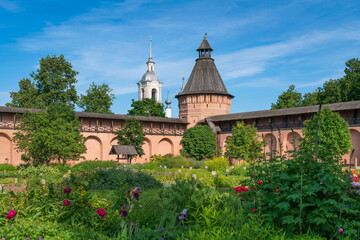 View of the towers and walls of the Spaso-Evfimiev Monastery and the Apothecary garden on the territory of the architectural and museum complex on a sunny summer day, Suzdal, Vladimir region, Russia