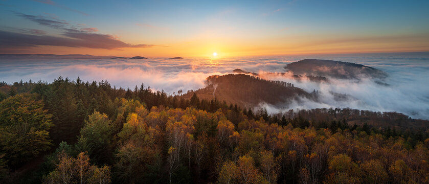 Sunset with a panoramic view over the Murg Valley and the upper Rhine plain during an inversion in the German North Black Forest