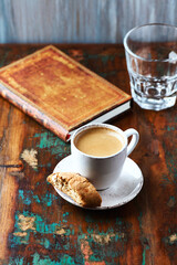 Cup of coffee and Cantuccini (Italian cookie) on dark wooden background. Copy space.