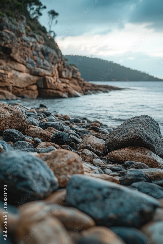 Poster a scenic view of a rocky beach with calm waters and unique rock formations