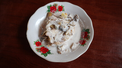 gulai jantung pisang, banana bud curry indonesian food, banana bud cooked with coconut milk and spices. top view