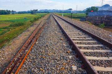 The view of the train tracks in the morning in rural Indonesia creates a romantic atmosphere