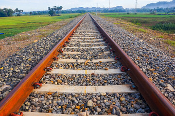 Naklejka premium The view of the train tracks in the morning in rural Indonesia creates a romantic atmosphere