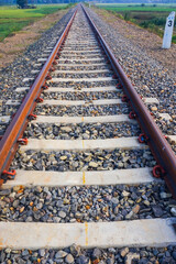 Naklejka premium The view of the train tracks in the morning in rural Indonesia creates a romantic atmosphere