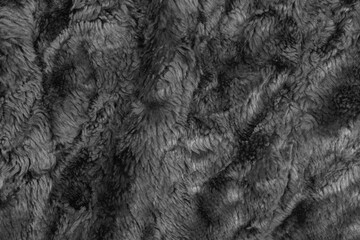 Black wool texture background. grey plush. mohair. fur