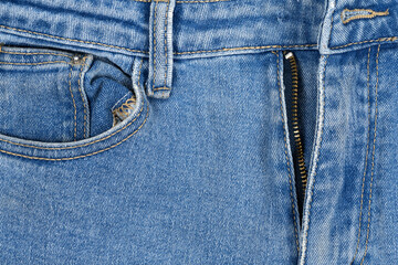 Fototapeta premium Blue jean pocket texture. jeans fabric texture background. front view. denim jeans background