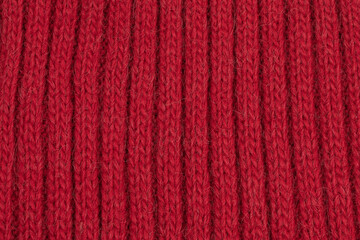 Red natural texture of knitted wool textile material background.  cotton fabric woven canvas texture