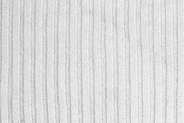 White natural texture of knitted wool textile material background. White cotton fabric woven canvas texture