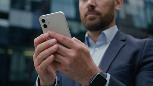Businessman using mobile phone smartphone gadget hands Caucasian man business client employer male office guy developer entrepreneur typing message cellphone internet connections city outdoor street