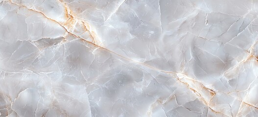 Fototapeta premium Elegant marbled texture background featuring soft beige and gray tones with subtle golden veins. Perfect for design and decoration projects.