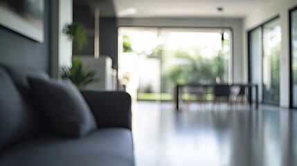 Blurred abstract image of an empty modern flat interior, emphasizing the contemporary design and spacious layout, with ample photo style copy space available.