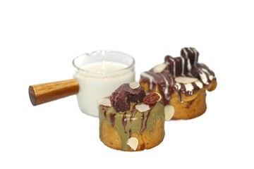 Bakery cake served on white background with chocolate chips on top,isolate concept.