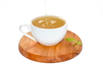 Pictures of cup tea serving on wooden plates in isolated concept.