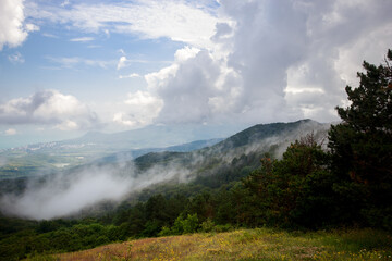 Mountains in Crimea before the rain.  Cloud and fog descend on the mountains. Vivid photo of natural landscapes.