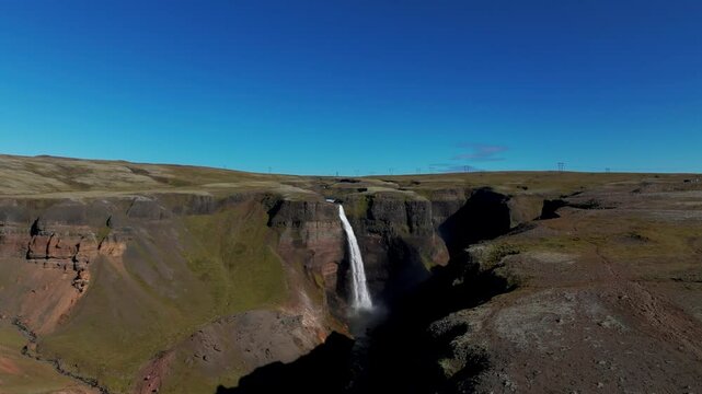 Aerial View Of Haifoss Waterfall In Highlands Of Iceland On Sunny Day. drone ascend