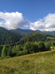 Majestic Mountain Landscape Under Blue Sky With Clouds