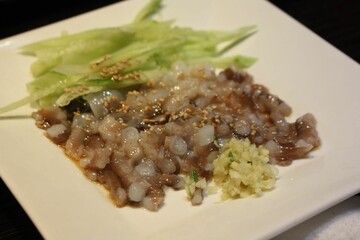 chopped live octopus, cucumbers, and wasabi