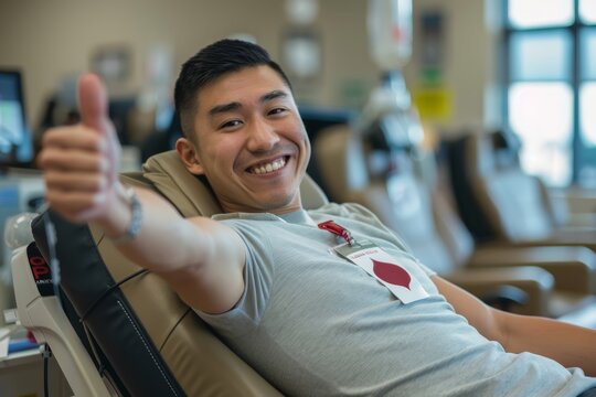 Happy Blood Donor Giving Thumbs Up